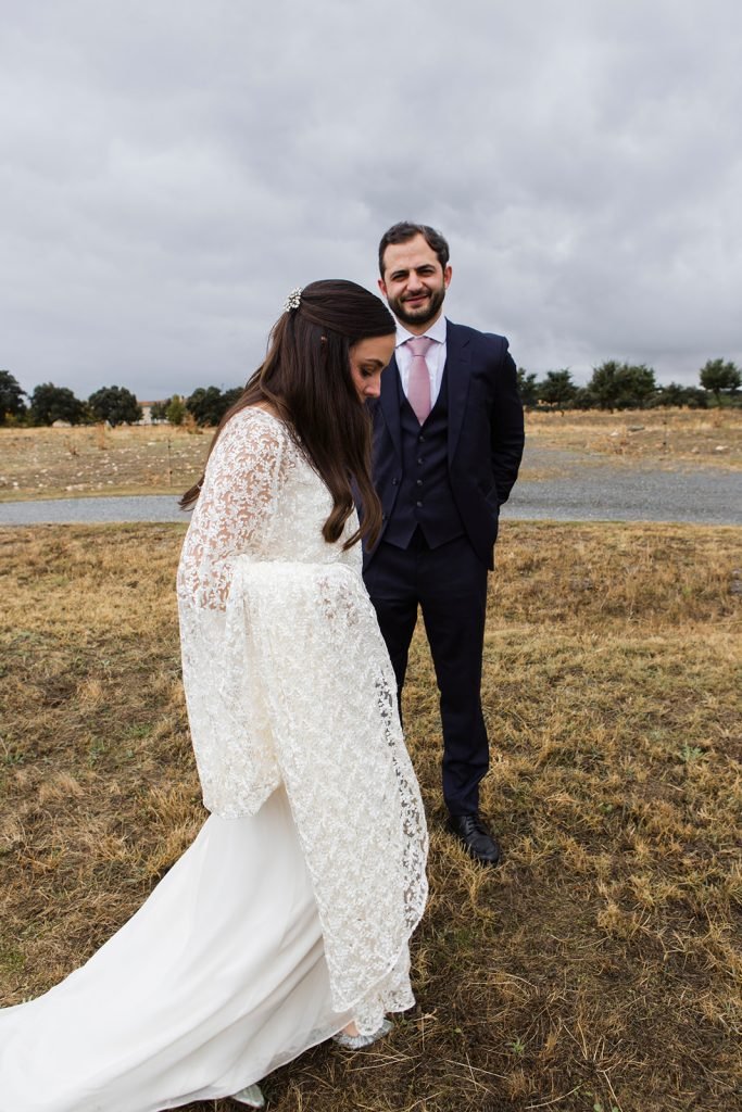 Natural and intimate wedding couple portraits outside a rustic chapel in the countryside. Timeless wedding photography by Flor de Sal Photo.