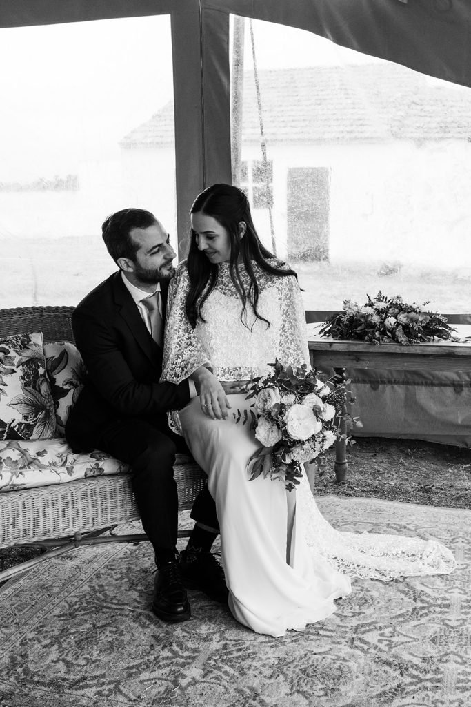 Natural and intimate wedding couple portraits outside a rustic chapel in the countryside. Timeless wedding photography by Flor de Sal Photo.